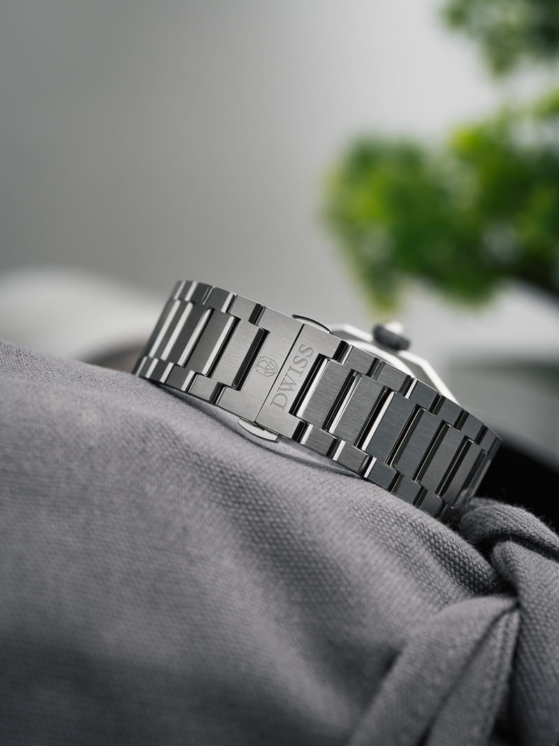 DWISS Model A1 watch strap displayed on a grey fabric 